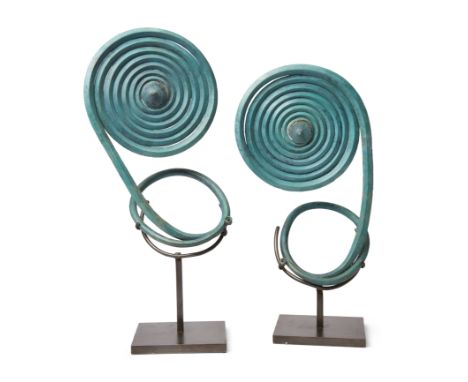 Two massive Central European copper alloy spiral arm-guards, Bronze Age, circa 12th-9th Century B.C., formed from single coil