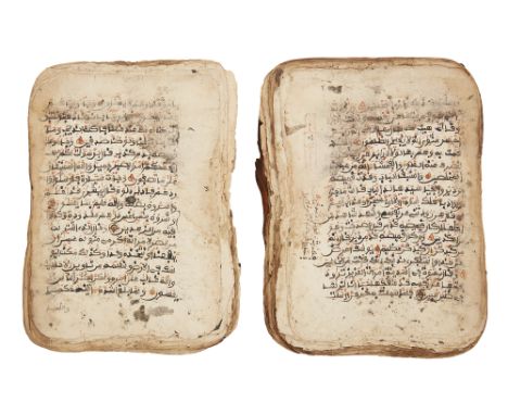 A West African Qur'an, 19th century, Arabic manuscript on paper, unbound, incomplete, with 17 and 18ll. of black maghrebi tex