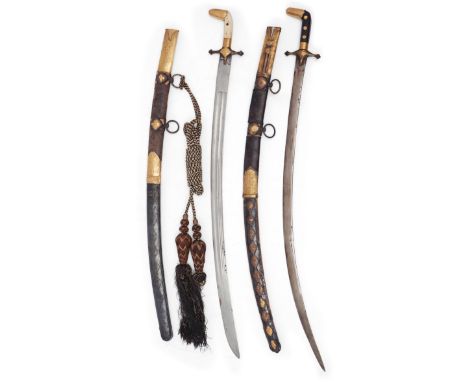 Two swords (sayfs), South Arabia, circa 1900, The first with watered steel blade, the grip with hardwood facings and gold she