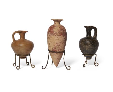 Two Egyptian Middle Kingdom pottery vessels, including an ovoid alabastron tapering to a point, with an out-turned rim and re
