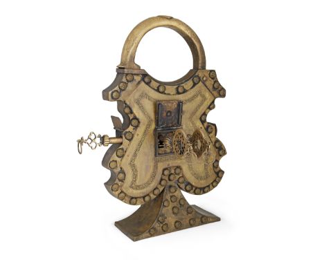 A rare monumental brass padlock and keys, Persia, 18th century or later, of curvilinear waisted form with a large rounded han