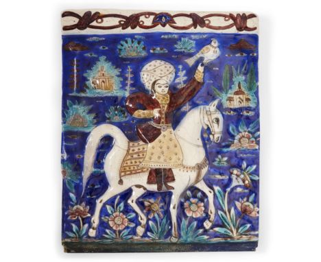 A moulded Qajar pottery tile, Qajar Iran, possibly Isfahan,19th century, d the polychrome decoration depicting a mounted prin