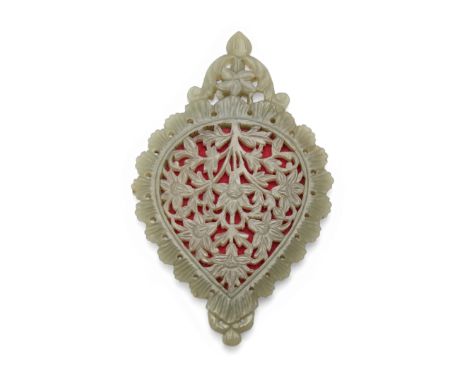 A drop-shaped, carved and openwork pale green jade mirror, India, late 19th century, with a large floral spray, a rosette wit