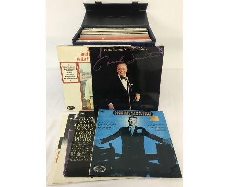 A vintage blue coloured record case containing 33 vinyl records; mostly Frank Sinatra. To include double LP's. 