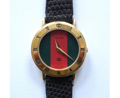 LADIES GUCCI GOLD PLATED WRISTWATCH
with a circular dial marked to the outer ring with Roman numerals, a quartz movement with