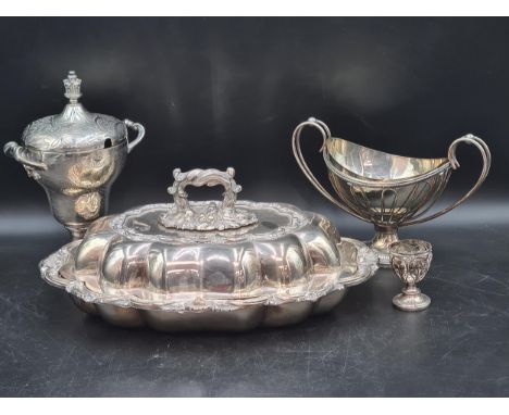 A plated two handled Cup and Cover of ogee form with crown finial, 9in, an oval Entree Dish and Cover, oval Sugar Basket, Egg