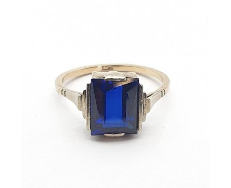 An Art Deco synthetic Sapphire Ring set rectangular step-cut stone, stamped 9ct, ring size L 1/2, approx 2.3gms