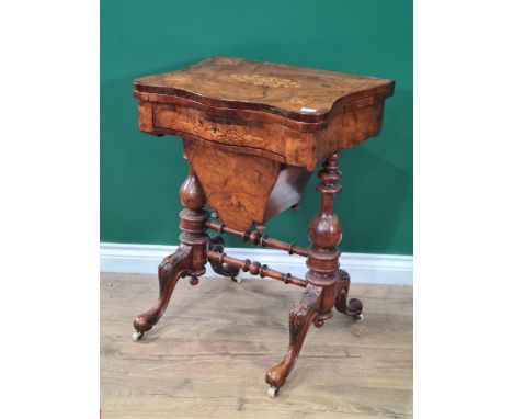 A late Victorian walnut &amp; satinwood marquetry Games/Sewing Table with shaped fold-over top enclosing checkers &amp; backg