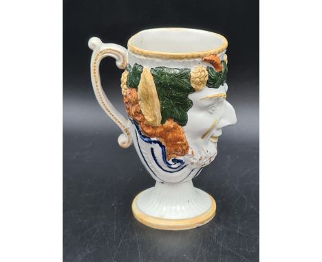 A Prattware pottery Bacchus Frog Mug with blue, yellow, ochre and green decoration, 5in The Frog Mug has crazing all over, th
