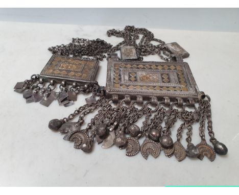 An Omani white metal with yellow metal applied decoration Amulet/Koran Holder(HIRZ) Necklace, along with a smaller example. O