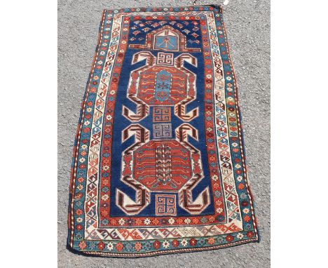 An antique Lenkoran Rug, Mihrab design with large crab motifs on an indigo field, no obvious fugitive dyes, old repairs, 6ft 