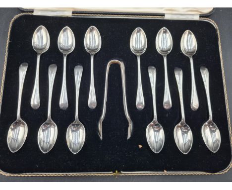 One dozen George VI silver Teaspoons and Sugar Tongs old english pattern, Sheffield 1937/8, in case. Provenance: Reputedly gi