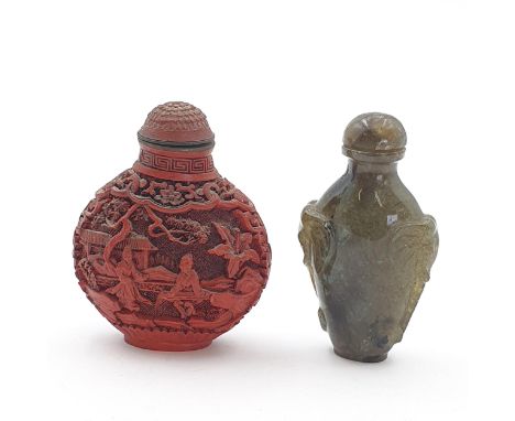 A carved cinnabar Chinese Snuff Bottle and a carved labradorite Chinese Snuff Bottle