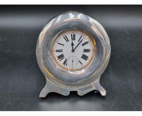 An early 20th century silver cased Travelling Clock with goliath watch having white enamel dial and subsidiary seconds dial, 