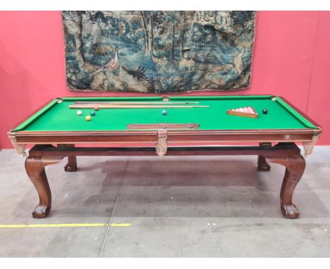 A mahogany Snooker Dining Table by E.J. Riley raised on cabriole supports and claw and ball supports, bearing impressed mark 