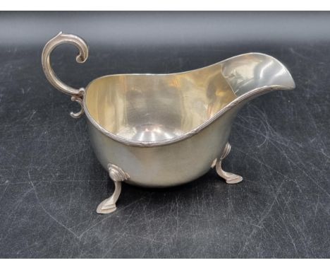 A George V silver Sauce Boat with scroll handle on hoof feet, London 1911, Asprey &amp; Co, Ltd, 170gms