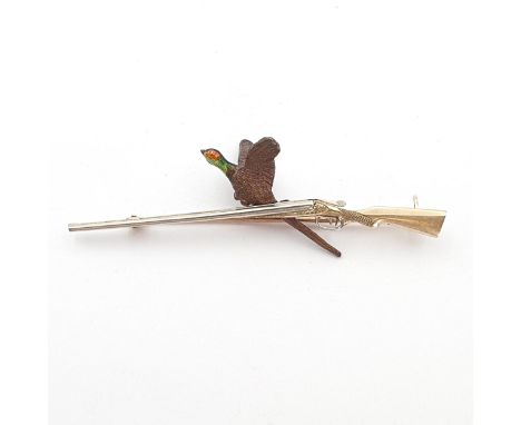 A Brooch realistically modelled as a shotgun and a textured brown and enamelled pheasant, stamped A W (possibly 9C?), pin sta