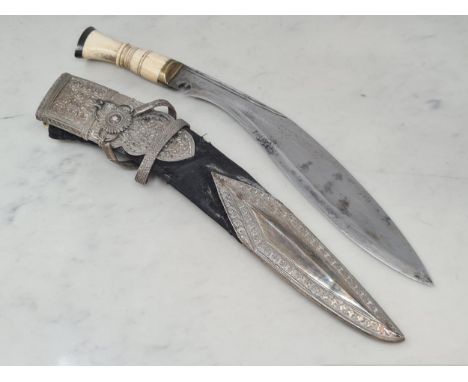 A very fine presentation Kukri Knife with white metal mounts embossed overall to a high standard