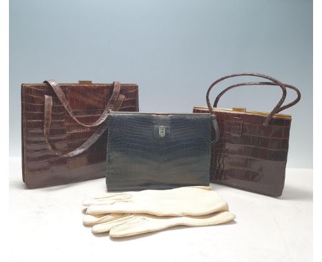 A collection of three vintage crocodile skin Handbags, one by Asprey and a pair of cream suede Driving Gloves
