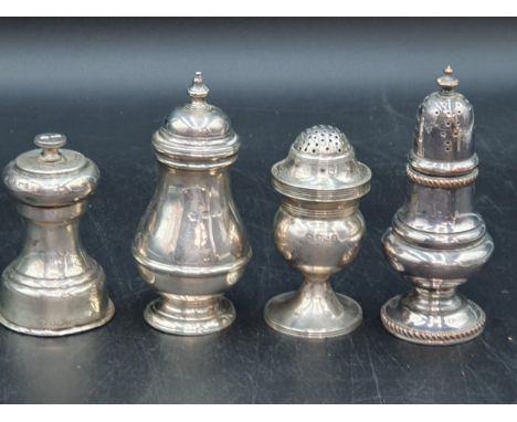 A George III silver Pepperette, London 1812, two silver Pepper Mills, London 1938 and Sheffield 1933, and a plated Pepperette