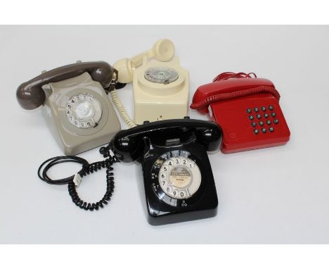 A 1960's black GPO dial telephone, number 746 68/1, together with two other dial telephones (one wall mounting) and a BT Trib