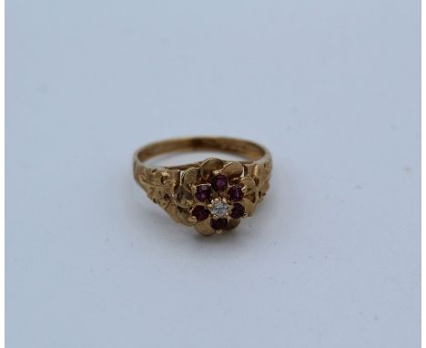 A ruby and diamond raised setting 9ct gold ring, size M.&nbsp;Gross weight approximately 3.2gm
