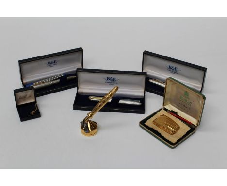 A selection of gentleman's items. Comprising a silver fountain pens, a Ronson gold plated lighter, a gold plated razor and ot