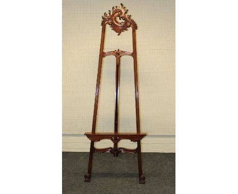An imported hardwood Rococo form artist's easel, 200cm high, maximum width 70cm