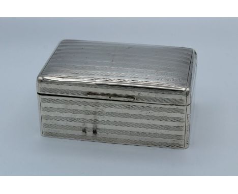 Walker and Hall, a George V silver cigarette box, with engine turned banded decoration and cedar lined interior, Sheffield 19