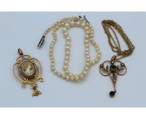 An Edwardian 9ct peridot and pearl openwork pendant on fine 9ct chain, an openwork pendant with central cameo and a graduated