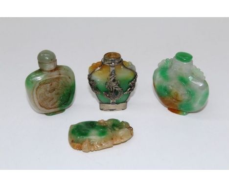 Three 20th century Chinese Jade snuff bottles, variously carved, one with silver Dragon overlay (lacking stopper), together w