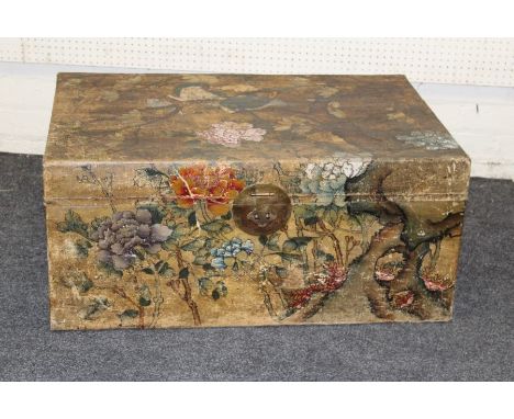 An early 20th century Chinese painted vellum trunk, decorated with peonies, other blooms and song birds. Twin side handles an