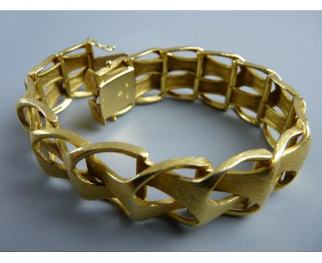AN EIGHTEEN CARAT GOLD BANGLE, wide linked, matt gold, 60 grms