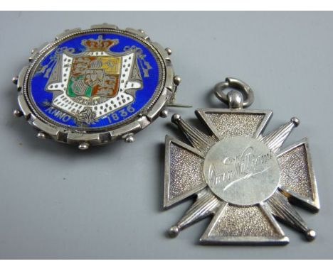 A SILVER CHORAL PRIZE PENDANT inscribed 'Owen Williams, Gwobr Gyntaf (First Prize)' and a circular silver and enamel royalty 