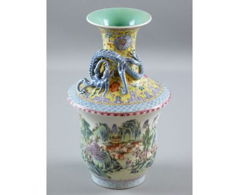 A CHINESE ENAMEL PAINTED PORCELAIN VASE, the flared central body with yellow ground floral decoration and applied dragon, Fam