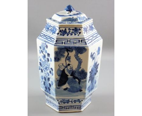 A CHINESE CERAMIC HEXAGONAL JAR & COVER in blue and white palette showing panels of an elder with attendant in a garden setti