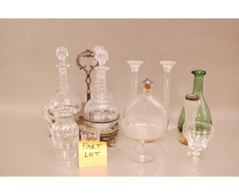 A large collection of glassware, including two silver topped examples, a set of three decanters on a plated stand, etc (qty)