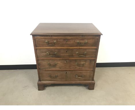 A George III mahogany chest drawers, with slide out folding shelf