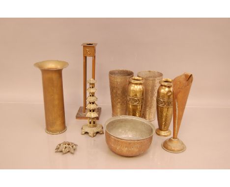 A art deco style copper candlestick, 26.5cm high, together with assorted brass pieces including, vases, trench art and a bowl