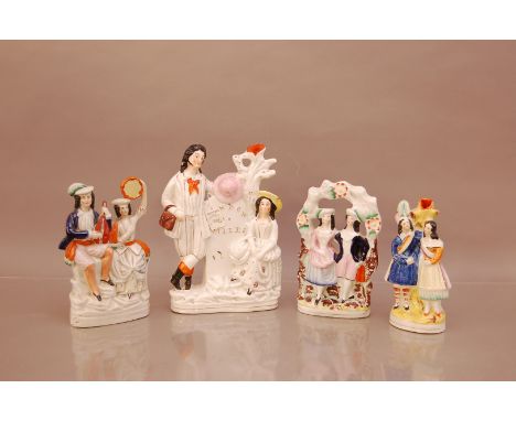 A 19th century ceramic hand painted Staffordshire figural group, London 30 Miles in gilt paint 27cm high, Provenance Sotheby'