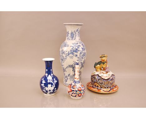 A group of four early 20th century Chinese ceramic items, including one large blue and whit vase, 38.5cm high, a further vase