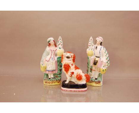 A pair of 19th century ceramic hand painted Staffordshire figures,  the male figure 29cm high, together with a Staffordshire 