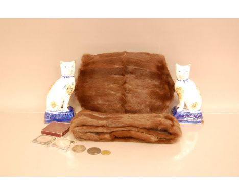 A pair of late 19th Ceramic Staffordshire pussy cats, together with a fur muff and shawl, and a small number of coins includi