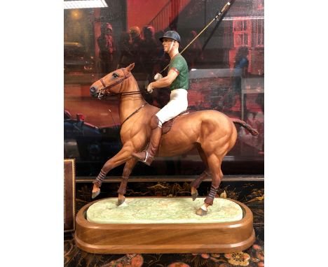 A ROYAL WORCESTER DORIS LINDNER FIGURE OF H.R.H. THE DUKE OF EDINBURGH ON HIS POLO PONY, WITH CERTIFICATE No. 45/750. W 27cms