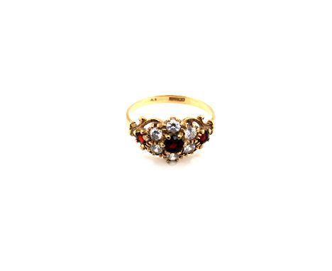 A HALLMARKED 9ct GOLD, GARNET AND CUBIC ZIRCONIA CLUSTER DRESS RING. FINGER SIZE N 1/2. WEIGHT 2.11grms. 