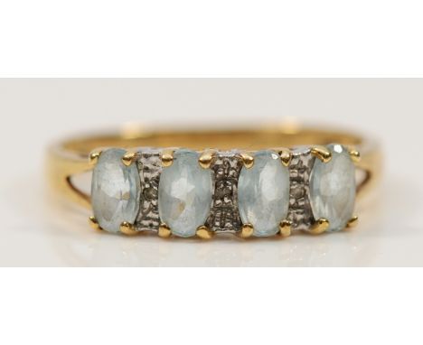 A 9ct gold blue topaz and diamond dress ring, O, 2.1g