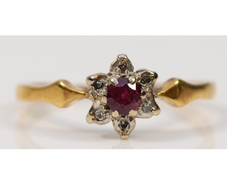 An 18ct gold ruby and diamond floral cluster ring, O, 2.4g