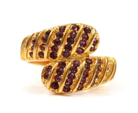 A Gem Emporia 18ct gold purple gemstone cross over ring, P, 6.1g