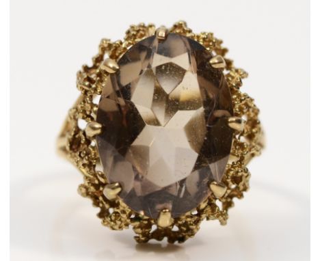 A 9ct gold smokey quartz cocktail ring, 17mm x 12mm, K 1/2, 4.8g