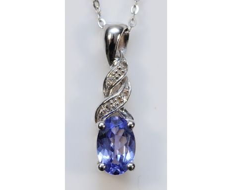 A 9ct white gold tanzanite and diamond pendant on a chain, 15mm, 1.3g